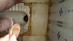 Masturbate using condom in dirty public toilet